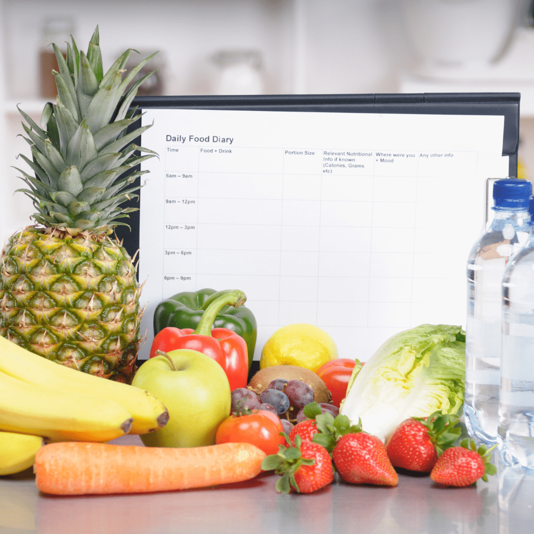 Personalised Food Diary Advice with fresh fruits and vegetables including pineapple, strawberries, carrots, and water bottle